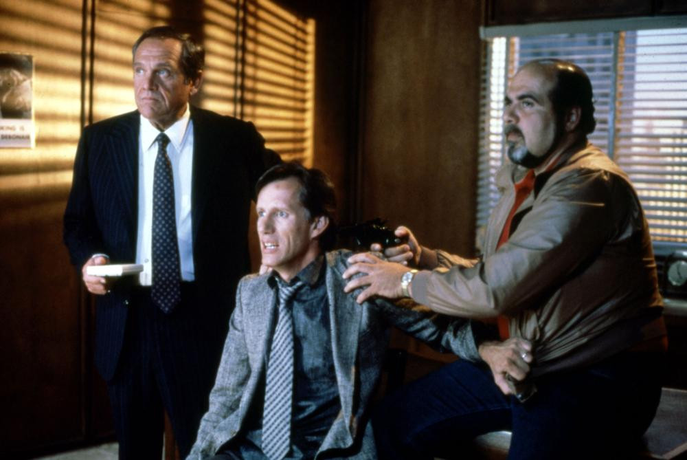 James Woods in a tense scene from Quitters Inc. segment of Cat's Eye movie
