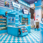 Jellycat Diner pop-up at FAO Schwarz New York featuring blue diner decor and plush food toys