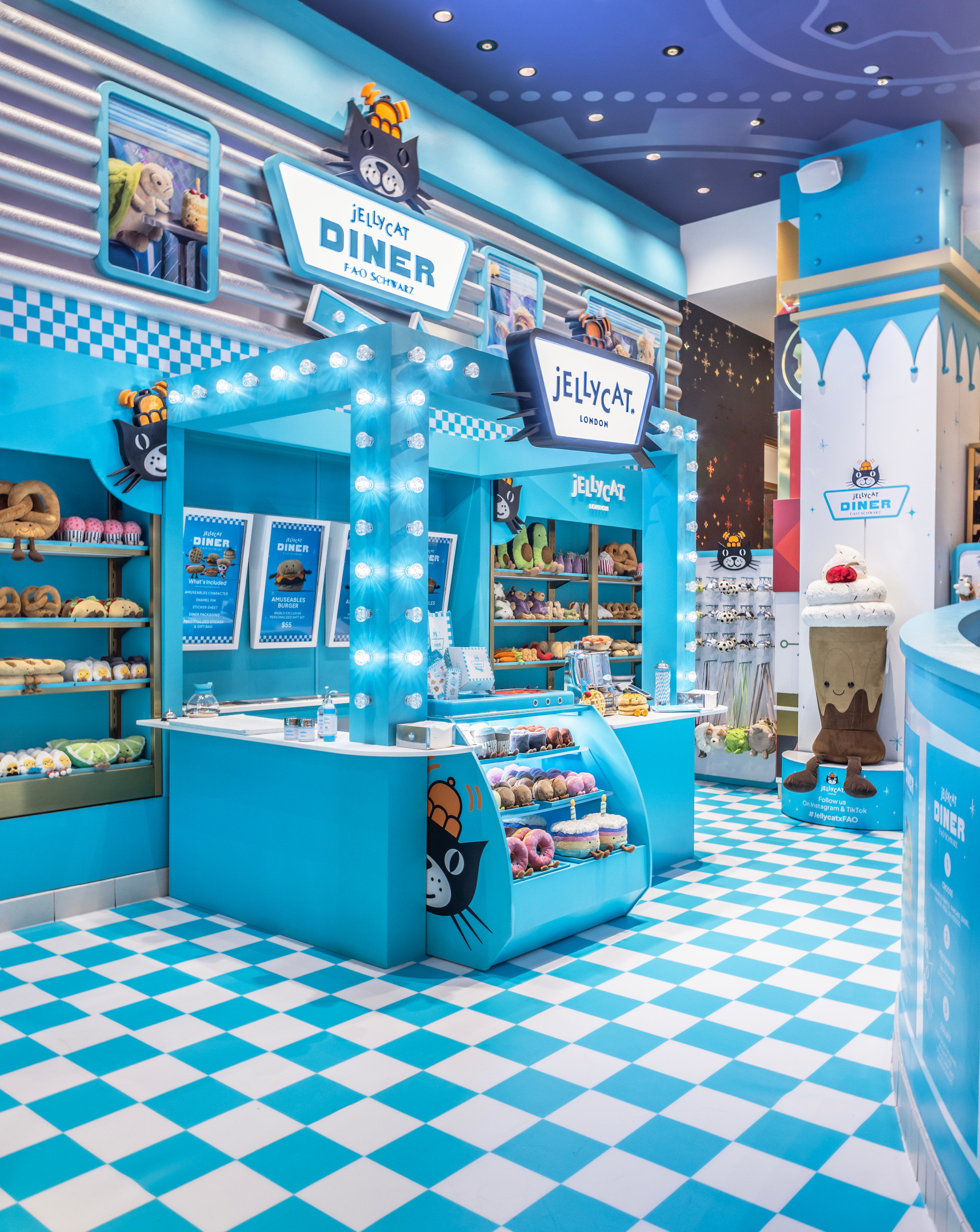 Jellycat Diner pop-up at FAO Schwarz New York featuring blue diner decor and plush food toys