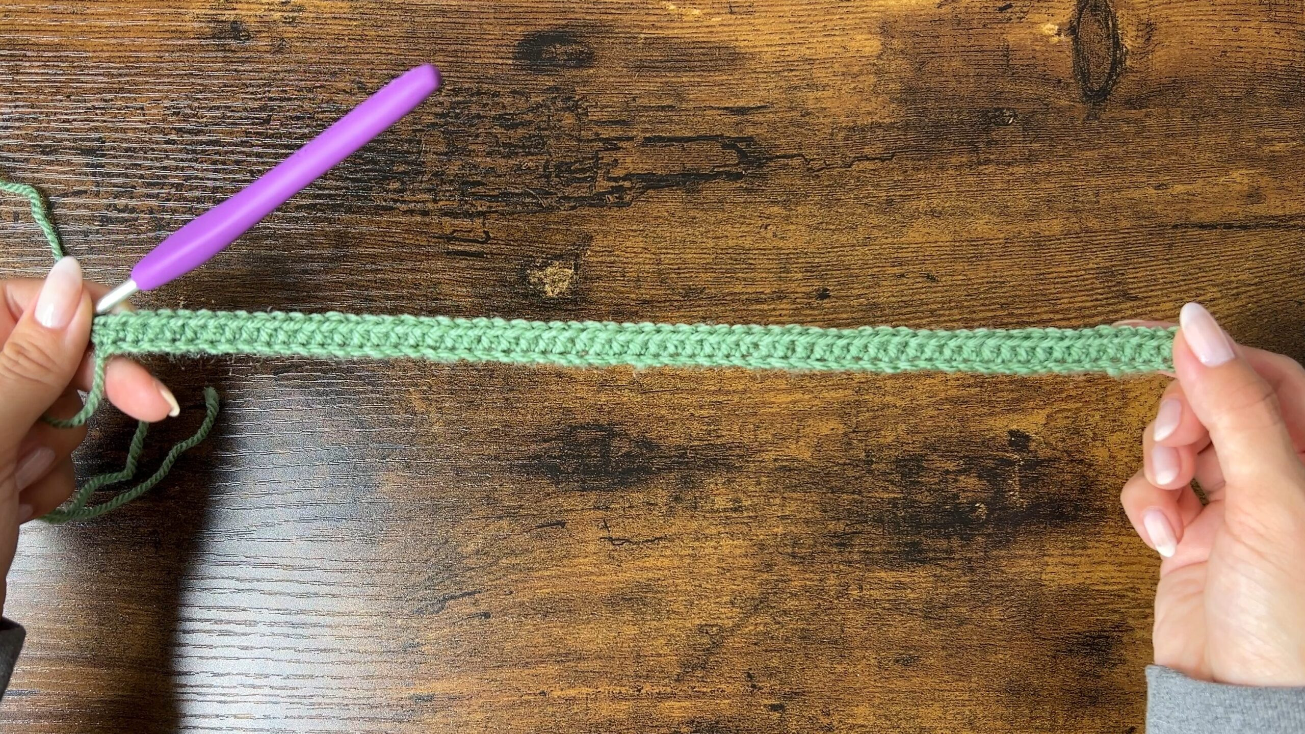 Image showing the first row of half double crochet stitches for the cat ear beanie