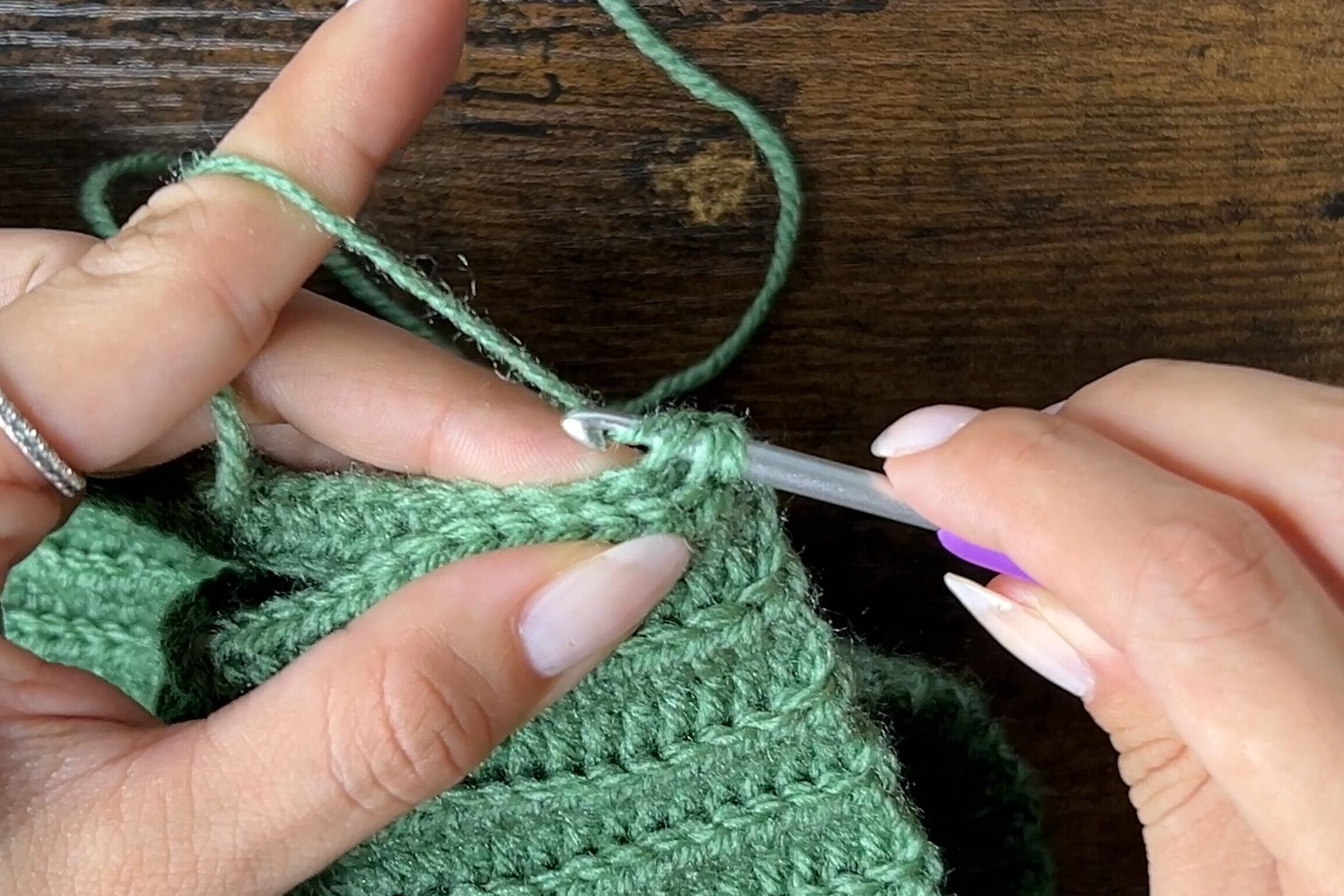 Image showing a close up of the slip stitch seam joining the sides of the crochet cat ear beanie