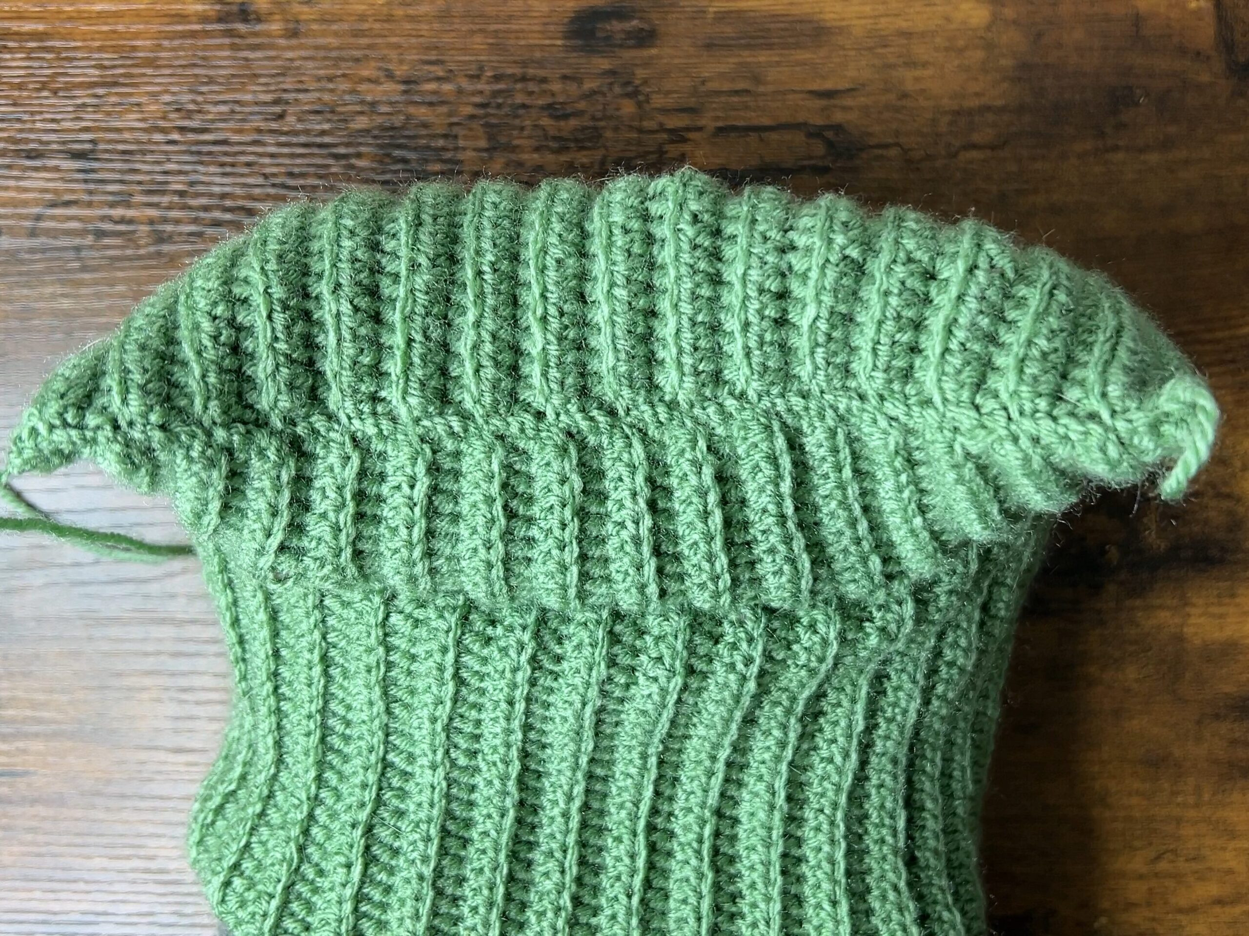 Image showing the finished sewn top of the crochet cat ear beanie