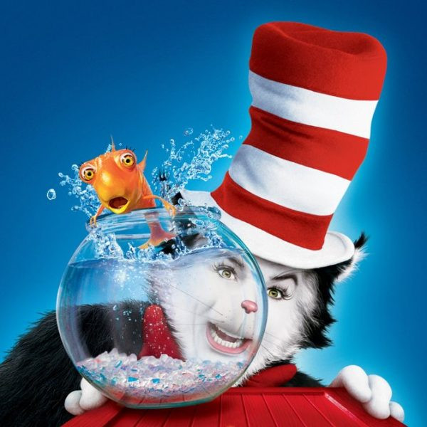 Mike Myers as The Cat in the Hat, showcasing the vibrant and detailed costume design, standing in the meticulously crafted set of Anville.