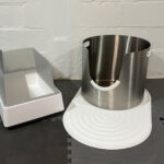 Comparison of premium cat litter pans: Tuft & Paw Cove open litter box and Less Litter L-5 stainless steel litter pan.