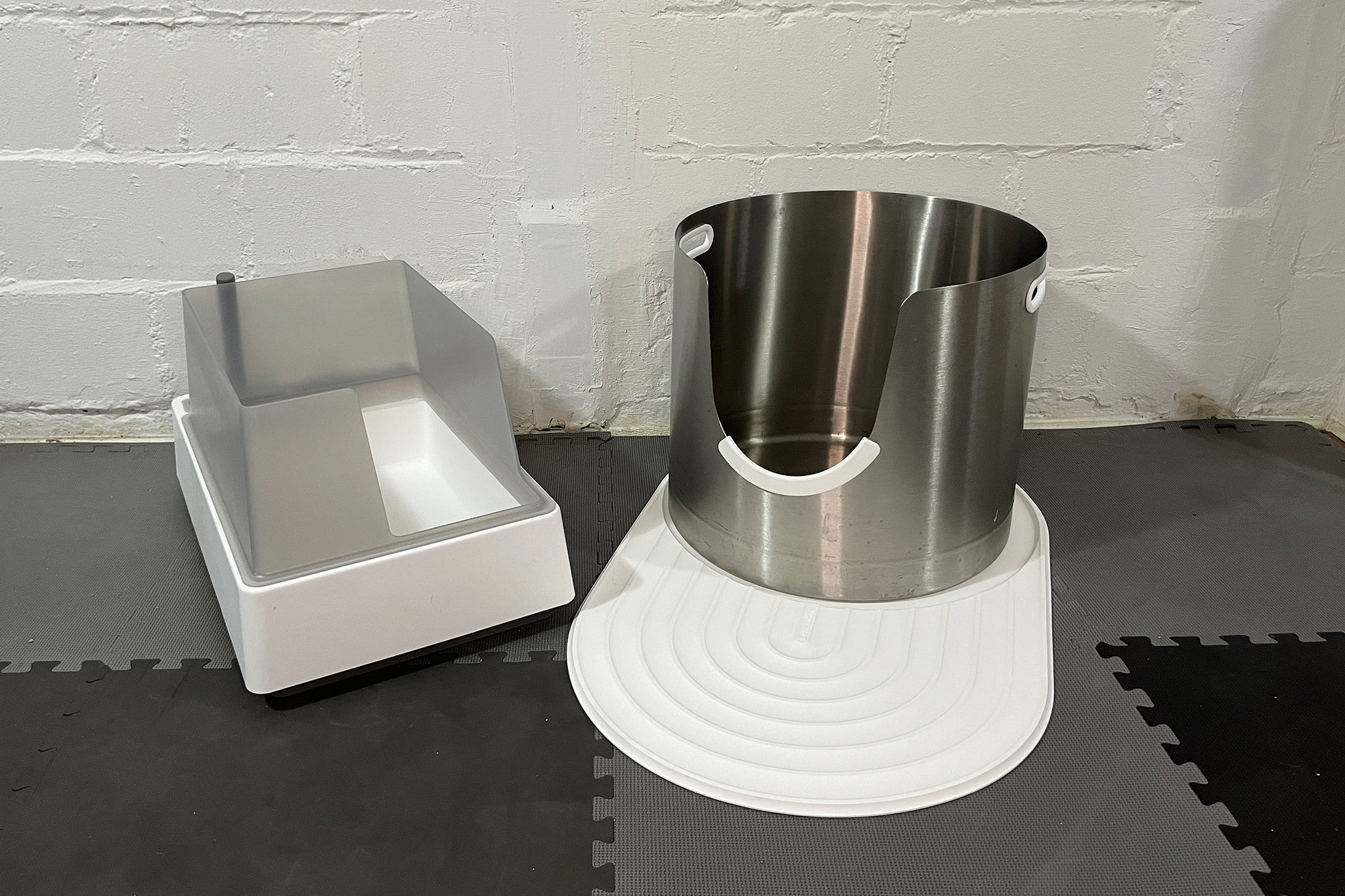 Comparison of premium cat litter pans: Tuft & Paw Cove open litter box and Less Litter L-5 stainless steel litter pan.