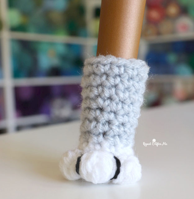 Cat paw chair socks protecting the floor under a chair leg