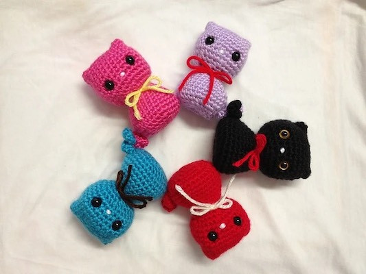 Colorful crochet cat toys in various bright colors, simple and appealing design