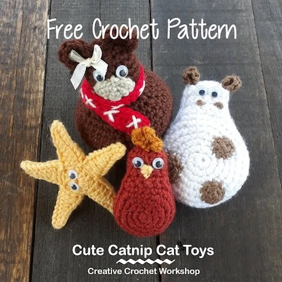 Collection of cute amigurumi crochet cat toys including a star, cow, and teddy bear