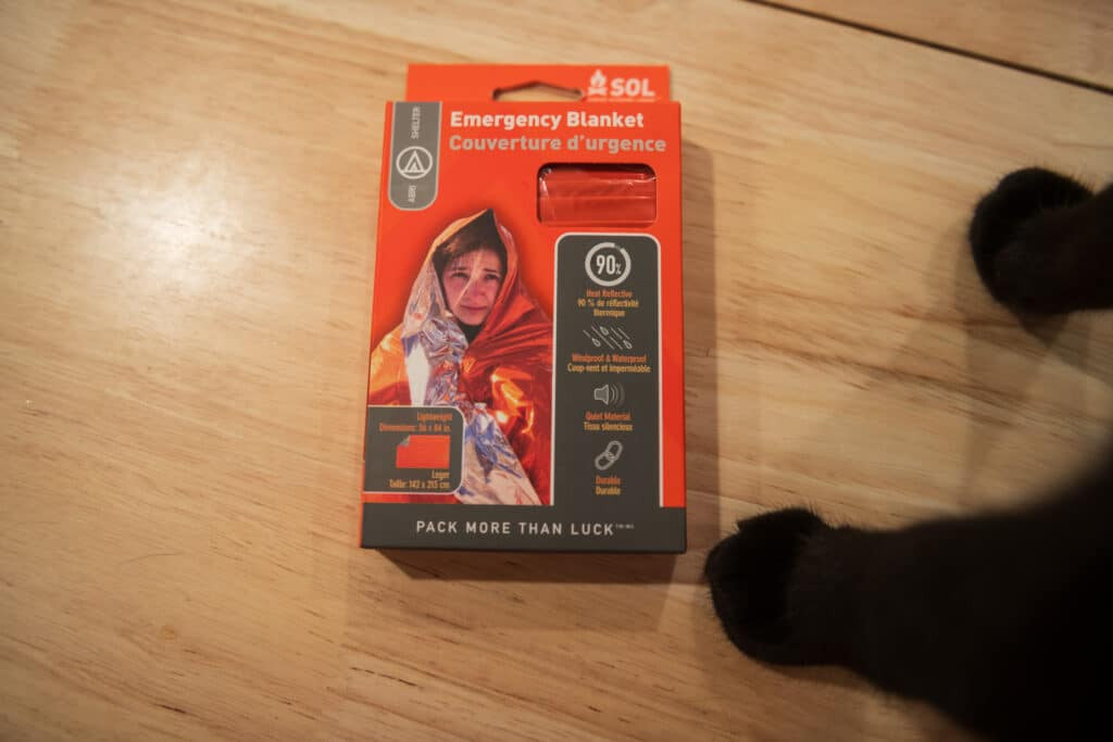 SOL Brand emergency blanket, a crucial component for windproofing a cat backpack carrier and reflecting heat.