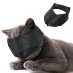 Stressed cat wearing a poorly designed muzzle with a small breathing hole, highlighting the discomfort and anxiety it causes.