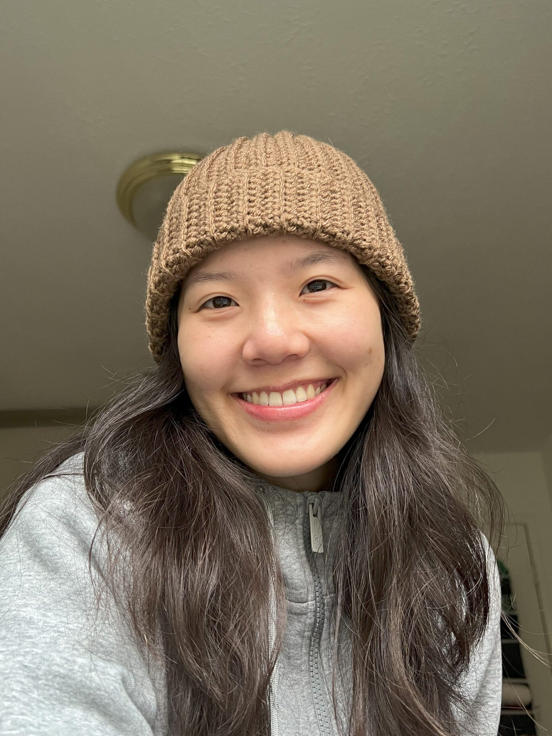 Image of a cream colored crochet ribbed beanie