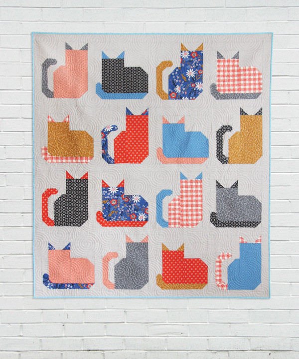 Charming Kitty Cats Quilt Pattern Displayed, showcasing adorable cat blocks in a colorful fat quarter quilt design.
