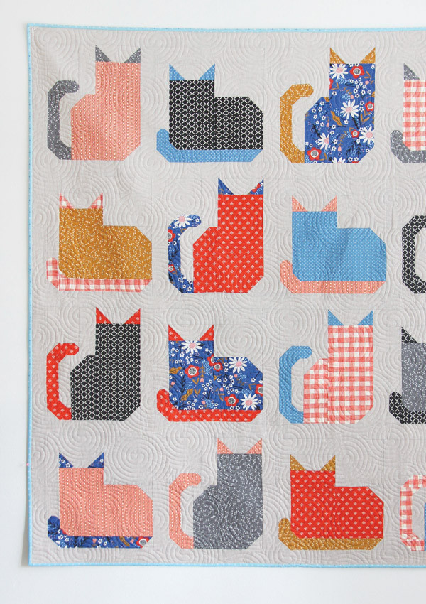 Quilt blocks layout for the Kitty Cats Quilt project, demonstrating the arrangement of adorable cat blocks before sewing, perfect for visualizing your cat themed quilt.
