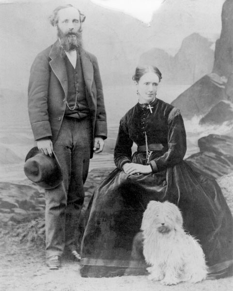 Portrait of James Clerk Maxwell, a man with a beard and mustache, in a formal suit.