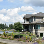 Exterior view of the vacation rental house featured in the Cats & Dogs film, showcasing its lakeside setting and architectural details