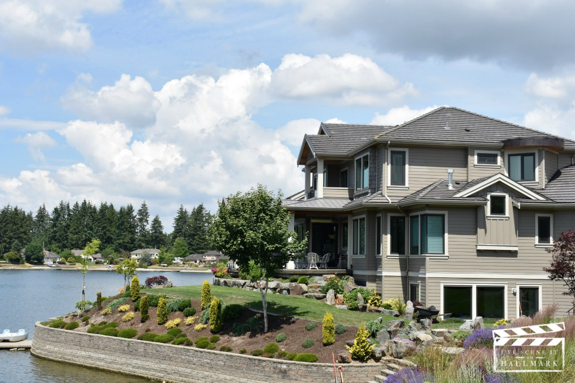 Exterior view of the vacation rental house featured in the Cats & Dogs film, showcasing its lakeside setting and architectural details