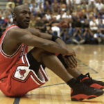 Michael Jordan in action, highlighting his agility and intensity, the essence of the 'Black Cat' nickname.
