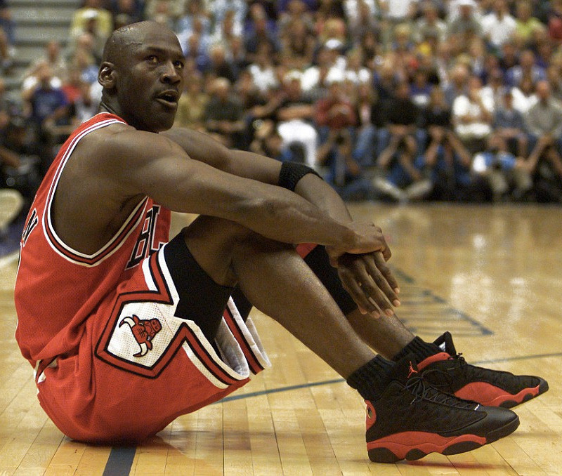 Michael Jordan in action, highlighting his agility and intensity, the essence of the 'Black Cat' nickname.