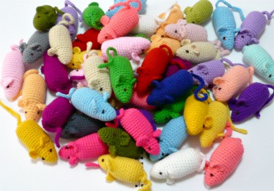 Two images of small crochet mouse cat toys in grey and pink, some with catnip inside