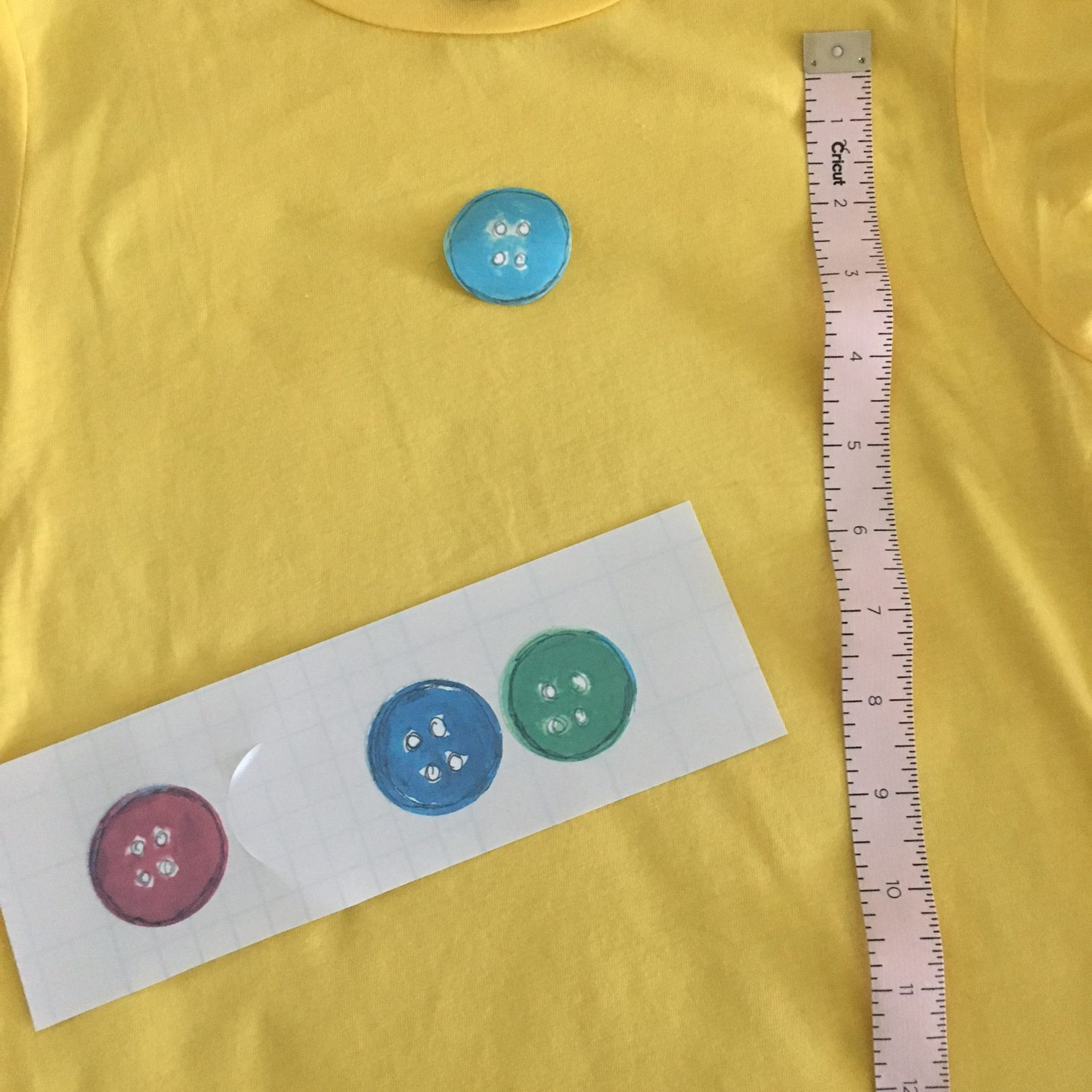 Ironing on Pete the Cat buttons
