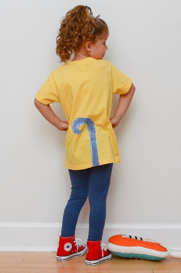 Child in Pete the Cat costume smiling