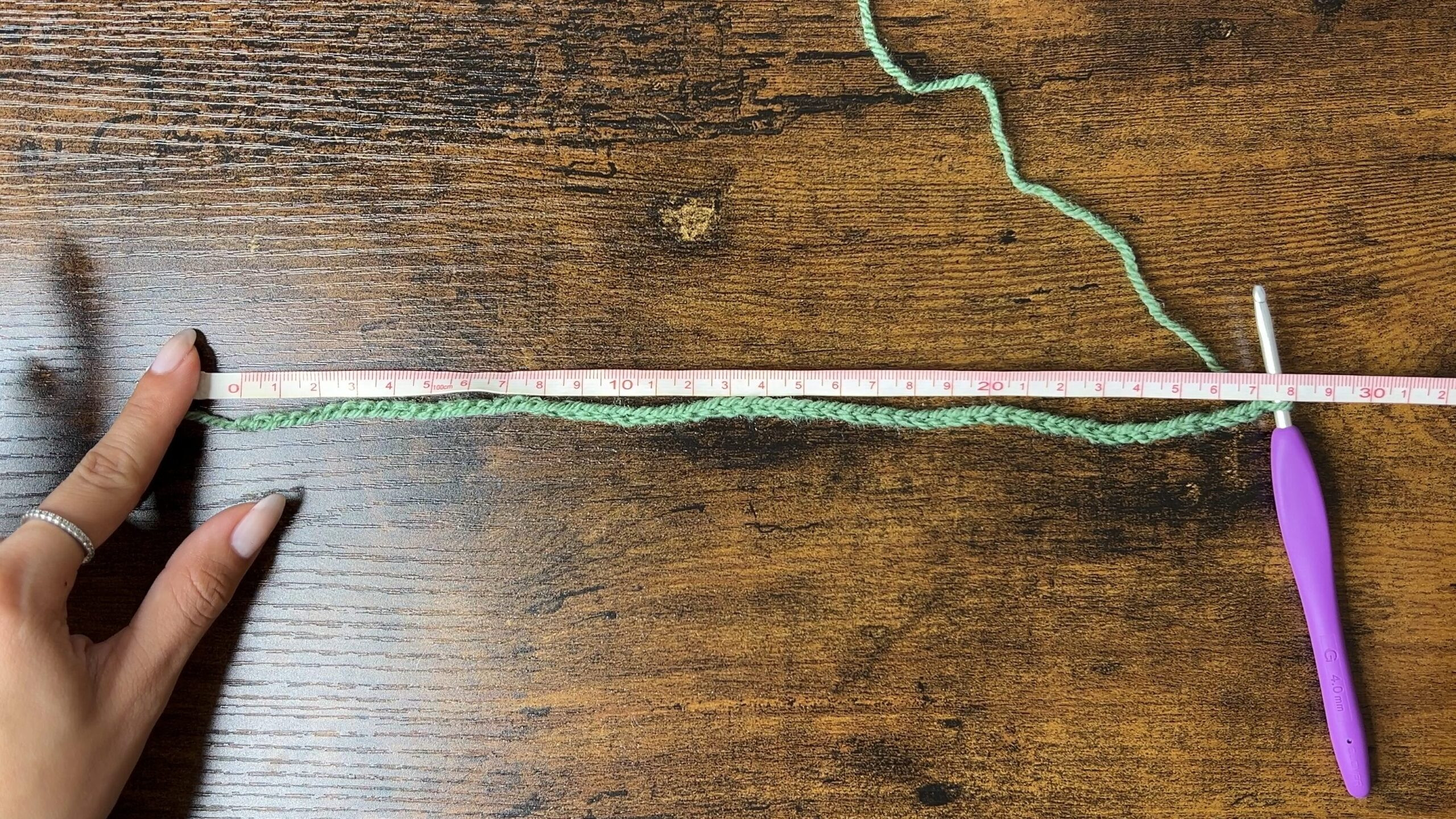 Still image from the video showing how to create the foundation chain for the crochet cat ear beanie