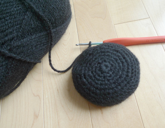 Close-up of crocheting Jiji's head, demonstrating the amigurumi crochet technique