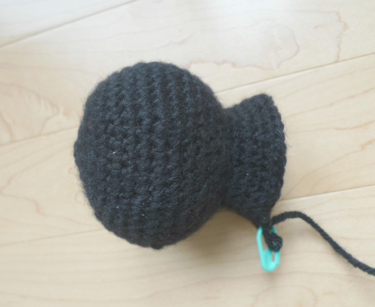Jiji amigurumi taking shape with the head and body being crocheted together
