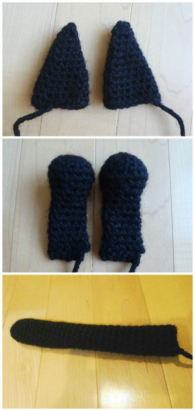 Crocheted parts of Jiji including ears, legs, and tail before assembly