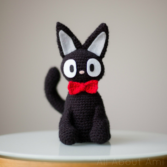 Finished crocheted Jiji cat amigurumi with felt eyes and nose details