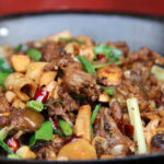 Braised Cat Meat Hot Pot served in China