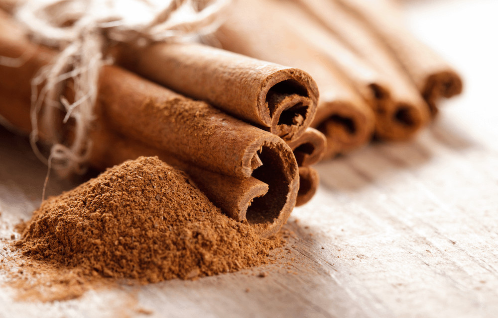 A close-up of cinnamon sticks, showcasing their texture and aroma, which is often disliked by cats